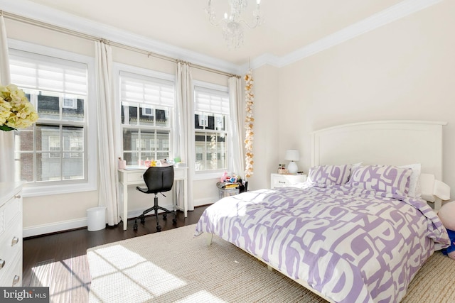 bedroom featuring crown molding, an inviting chandelier, dark wood-type flooring, and multiple windows