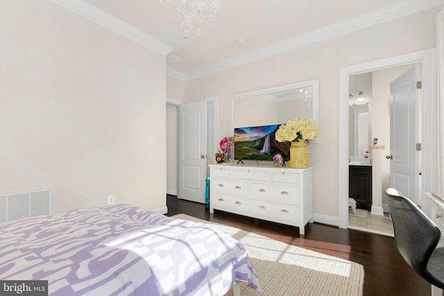 bedroom featuring dark hardwood / wood-style flooring, a notable chandelier, and ornamental molding