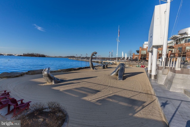 surrounding community featuring a water view