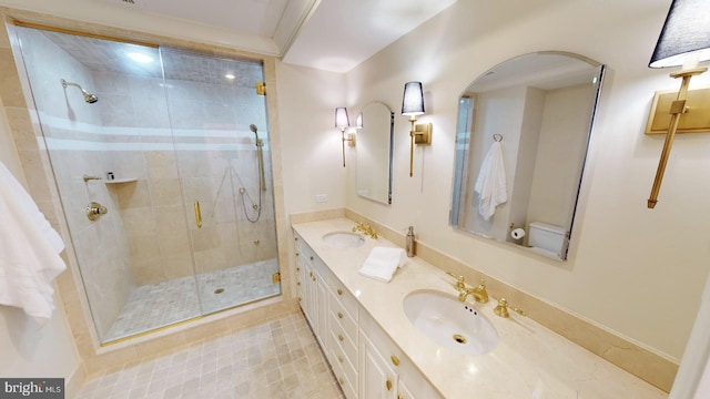 bathroom featuring vanity and a shower with door