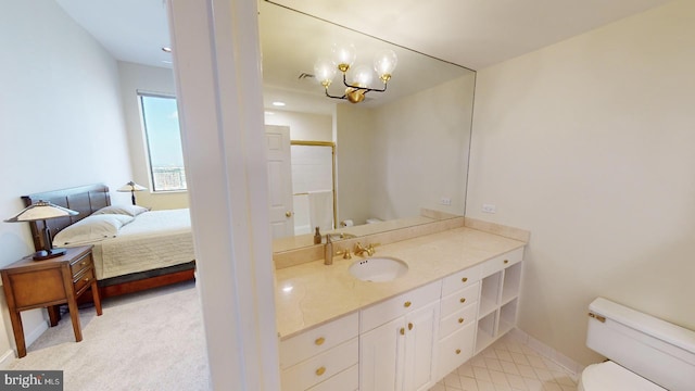 bathroom with vanity and toilet