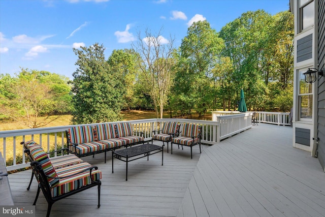 wooden deck with an outdoor hangout area