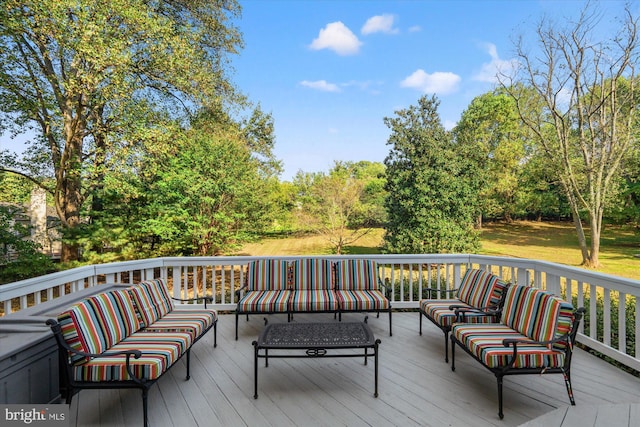 wooden terrace with outdoor lounge area