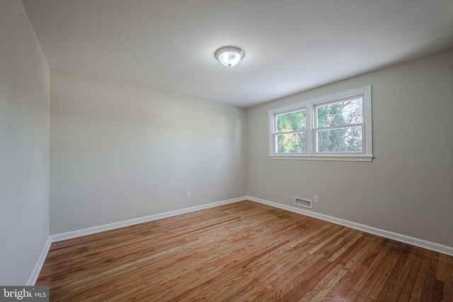 spare room featuring light hardwood / wood-style flooring