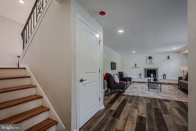 stairway featuring wood-type flooring