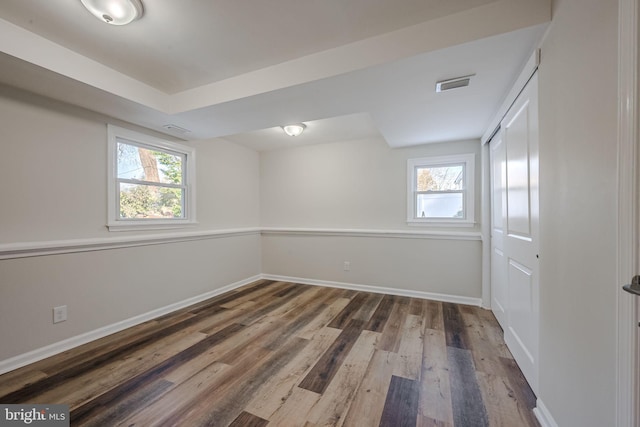 unfurnished room featuring hardwood / wood-style flooring