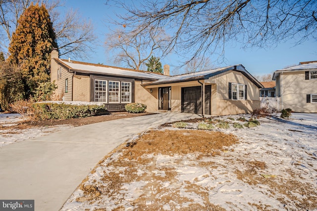 ranch-style home with a garage