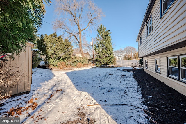 view of yard layered in snow