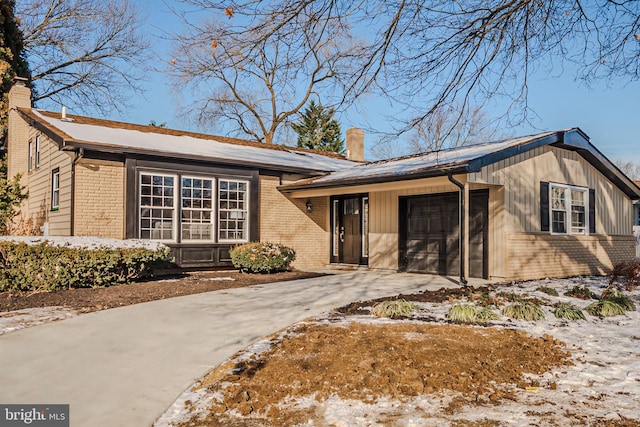 ranch-style house featuring a garage