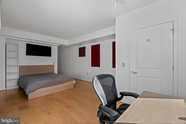 bedroom featuring hardwood / wood-style floors