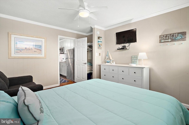 bedroom with ceiling fan, ornamental molding, a textured ceiling, and stainless steel refrigerator