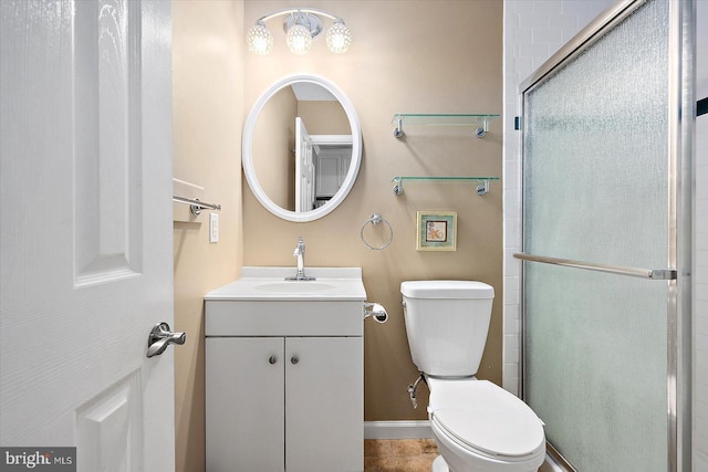 bathroom with vanity, toilet, and walk in shower