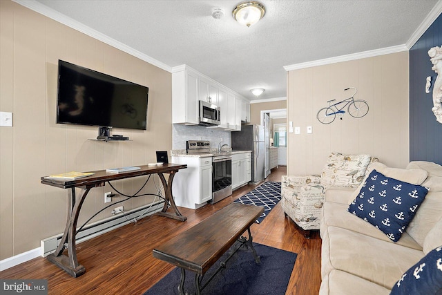 living room featuring ornamental molding, dark hardwood / wood-style floors, a textured ceiling, and baseboard heating