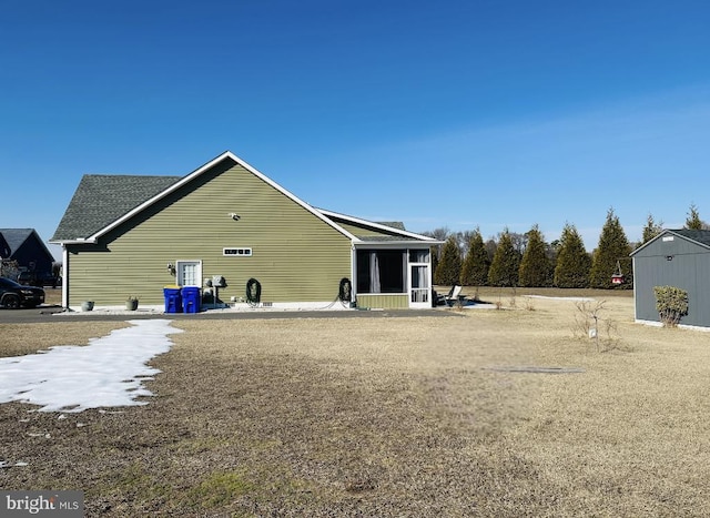 back of property featuring a sunroom