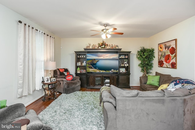 living room with hardwood / wood-style floors and ceiling fan