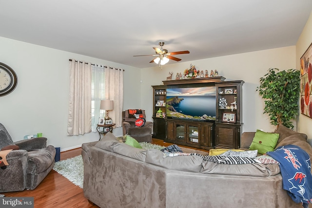 living room with hardwood / wood-style floors and ceiling fan