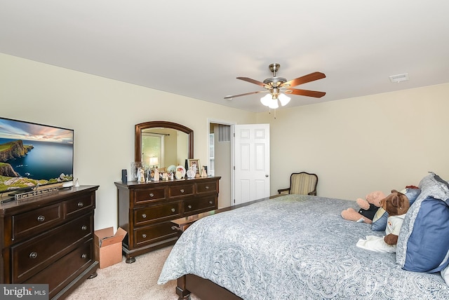 bedroom with ceiling fan and light colored carpet