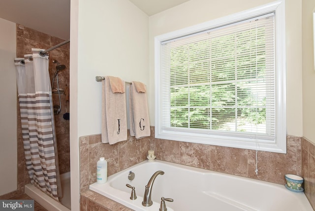 bathroom with shower with separate bathtub