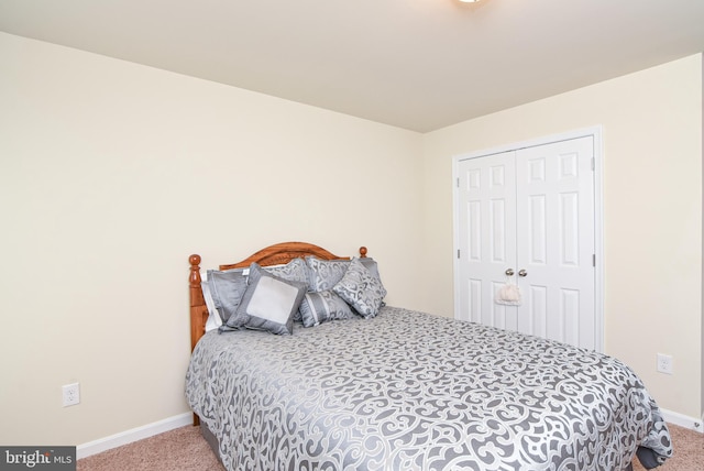 carpeted bedroom featuring a closet