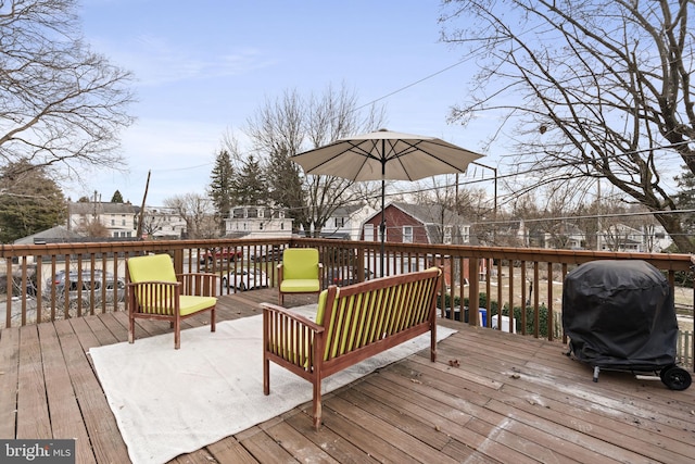 wooden deck with grilling area