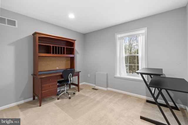 office space with light colored carpet