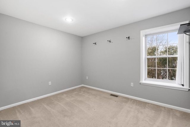 empty room with carpet flooring