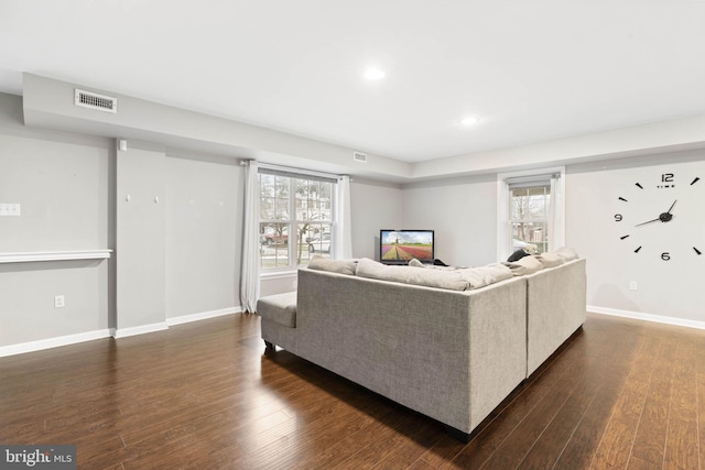 living room with dark hardwood / wood-style floors