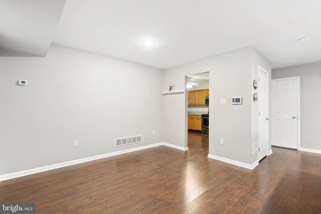 unfurnished living room featuring dark hardwood / wood-style flooring