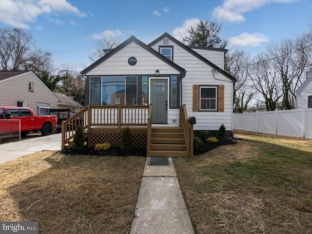 bungalow with a front yard