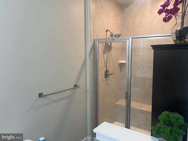 bathroom with a shower with shower door