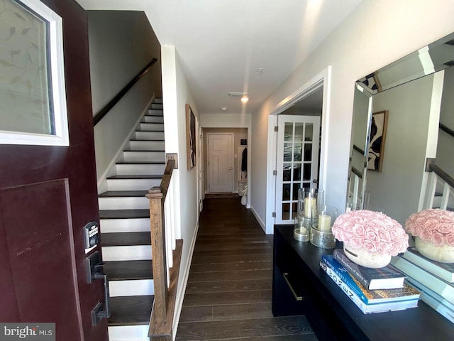 stairway with hardwood / wood-style flooring