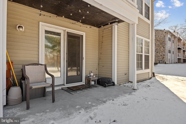 entrance to property with a patio area