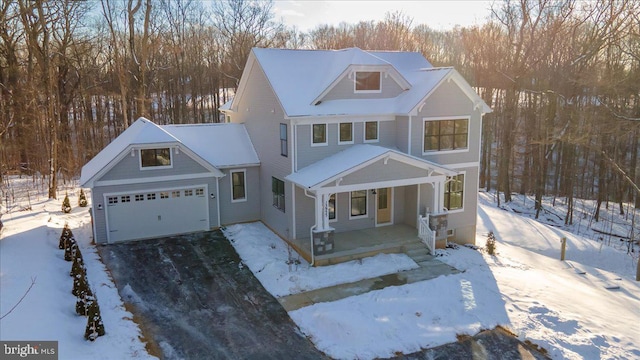 front of property featuring a garage and covered porch