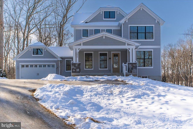 craftsman-style home featuring a porch and a garage