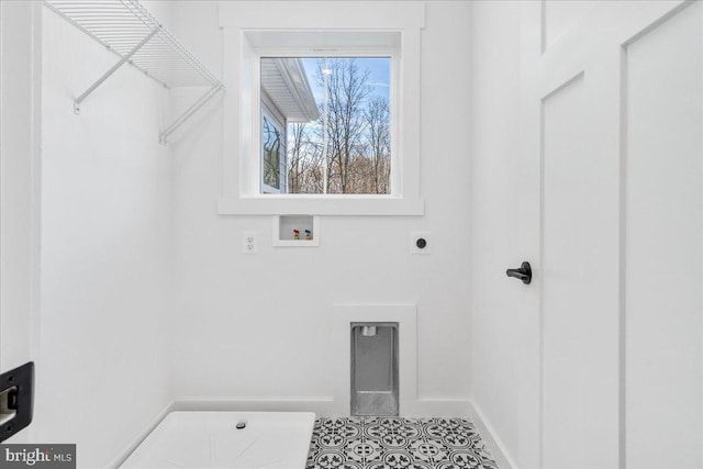 clothes washing area with hookup for a washing machine and hookup for an electric dryer