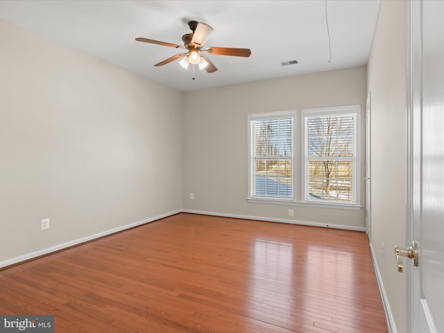 unfurnished room featuring ceiling fan and light wood-type flooring