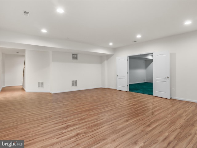 basement featuring light wood-type flooring