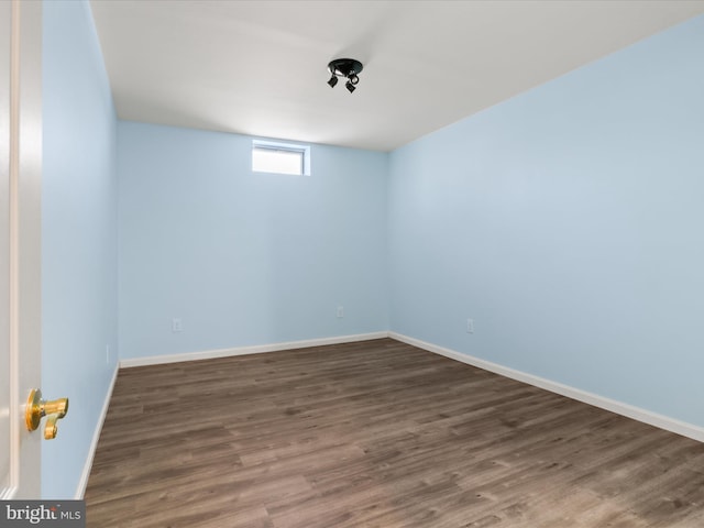 unfurnished room featuring dark wood-type flooring