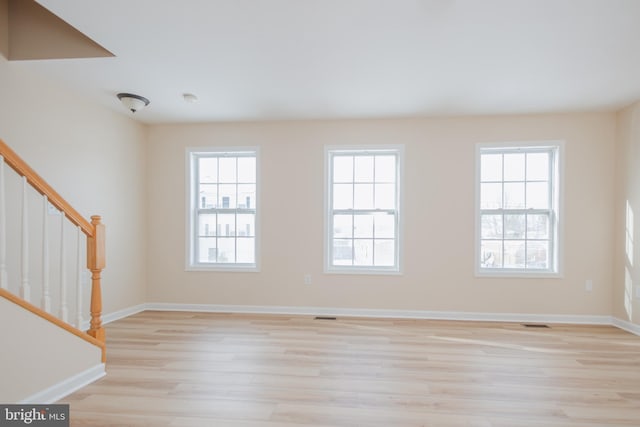 unfurnished room featuring light hardwood / wood-style flooring