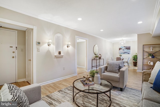 living room with ornamental molding and light wood-type flooring