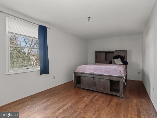 bedroom featuring dark wood-type flooring