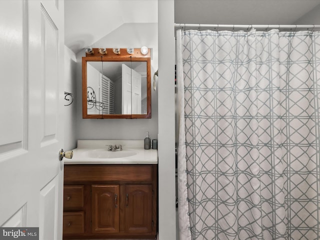 bathroom featuring vanity and walk in shower