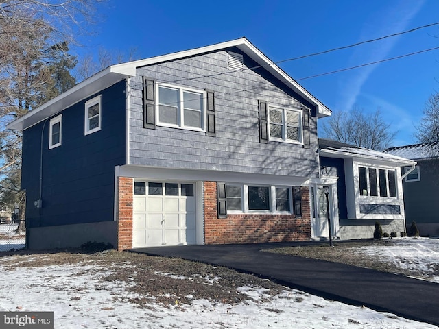 split level home with a garage