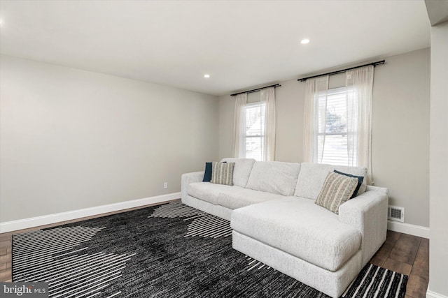 living room featuring dark hardwood / wood-style floors