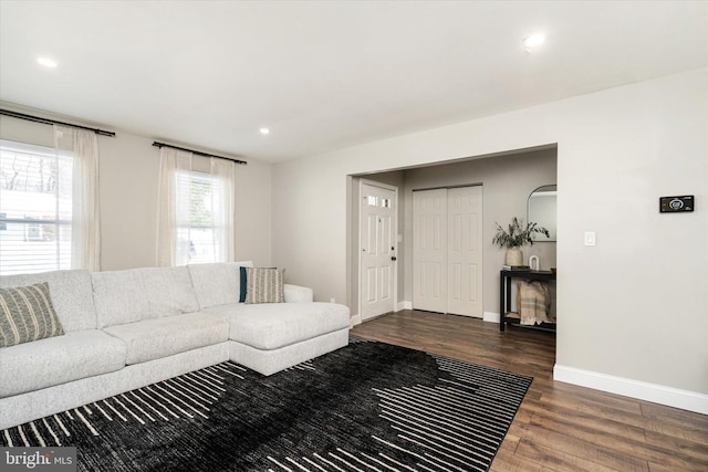 living room with dark wood-type flooring