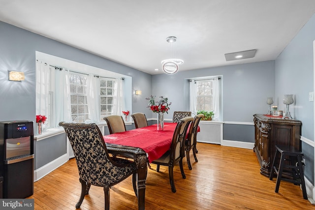 dining space featuring plenty of natural light and light wood-type flooring