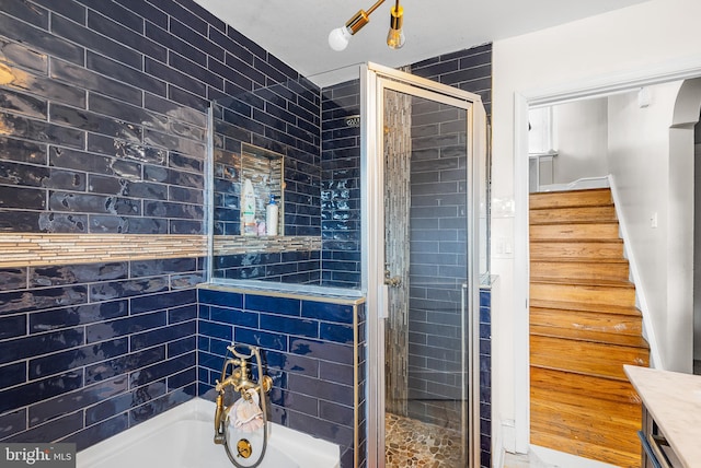 bathroom with vanity and plus walk in shower