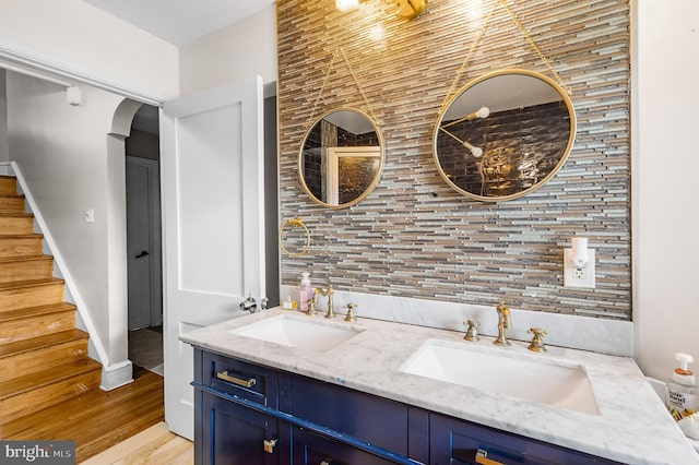 bathroom with hardwood / wood-style flooring and vanity