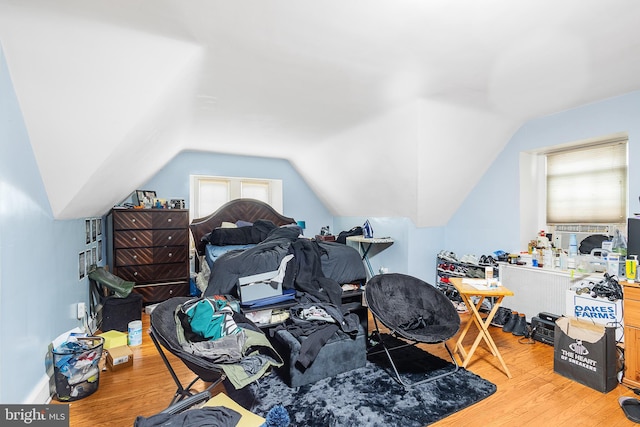 interior space featuring vaulted ceiling and light hardwood / wood-style floors