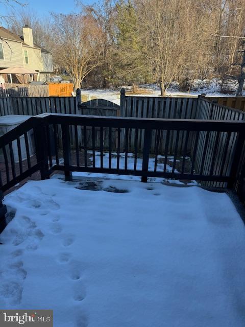 view of snow covered deck